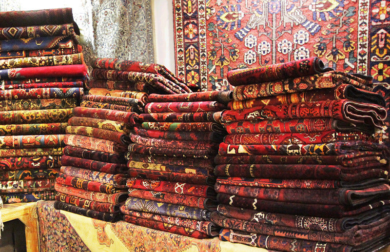 Rugs folded in Persian Oriental Rug Store